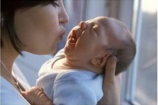 Mother-Kissing-Infant-Photo-1.jpg