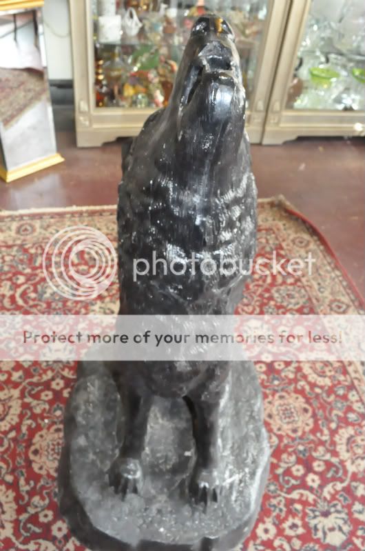 Heres a special one of a kind item. This Wolf sculpture is made of 